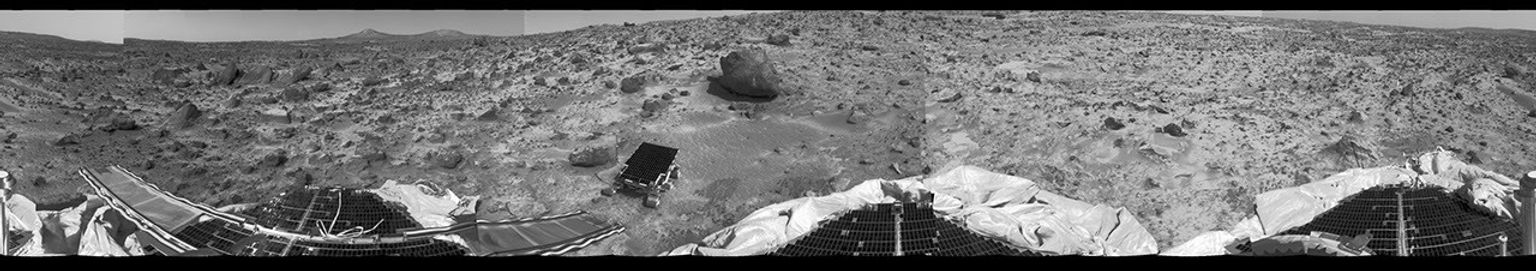 This 360 degree 'monster' panorama was taken by NASA's Mars Pathfinder (IMP) on Sol 3. All three petals, the perimeter of the deflated airbags, deployed rover Sojourner, forward and backward ramps and prominent surface features are visible.