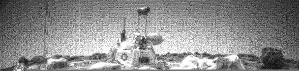 One of the two forward cameras aboard NASA's Sojourner rover took this image of the Sagan Memorial Station on Sol 25. The camera uses a fisheye lens which produces the illumination gradient in the sky on the western horizon. Sol 1 began on July 4, 1997.