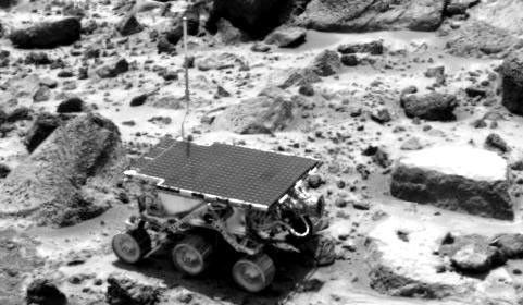 This image obtained by NASA's Imager for Mars Pathfinder (IMP) of the Sojourner rover was taken near the end of daytime operations on Sol 42. The rover is between the rocks 'Wedge' (left) and 'Flute Top' (right). Sol 1 began on July 4, 1997.