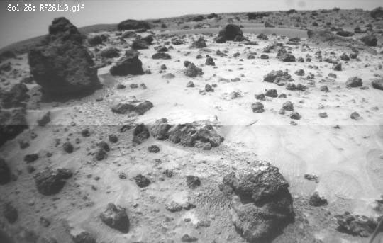 This image, taken NASA's Sojourner's front right camera, was taken when the rover was next to Poohbear (rock at left) and Piglet (not seen) as it looked out toward Mermaid Dune. Sol 1 began on July 4, 1997.