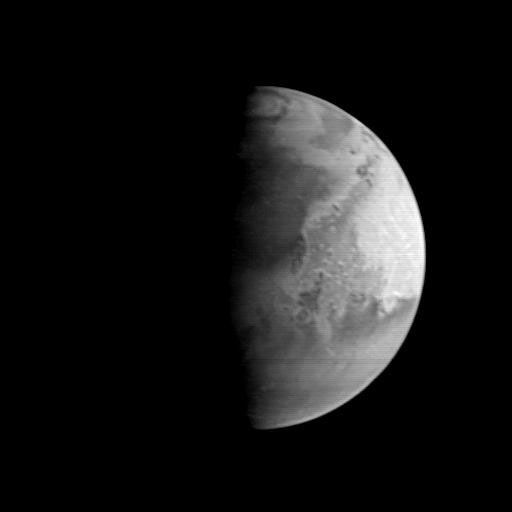 This image of Mars from NASA's Mars Global Surveyor Orbiter shows an area centered near the Pathfinder landing site. The dark area north of the center of the image along the sunrise terminator is Acidalia Planitia.