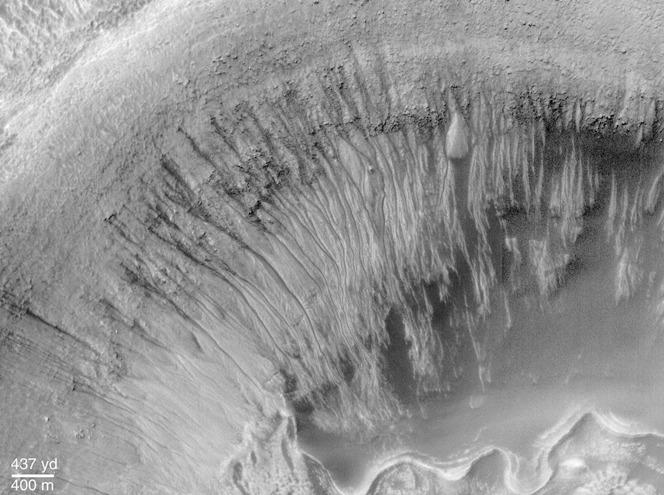 This image from NASA's Mars Global Surveyor of Newton Crater, a large basin formed by an asteroid impact that probably occurred on Mars more than 3 billion years ago.