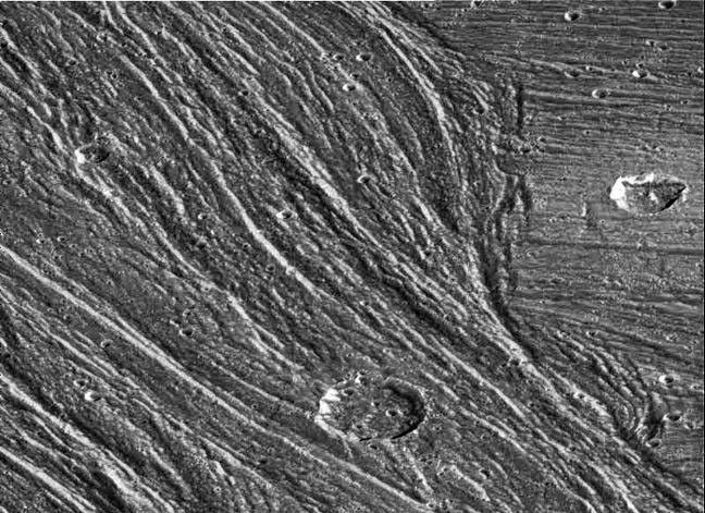 Complex sets of ridges and grooves are visible in this image of the Nippur Sulcus region on Jupiter's largest moon Ganymede. NASA's Galileo spacecraft imaged this region as it passed Ganymede during its second orbit through the Jovian system.