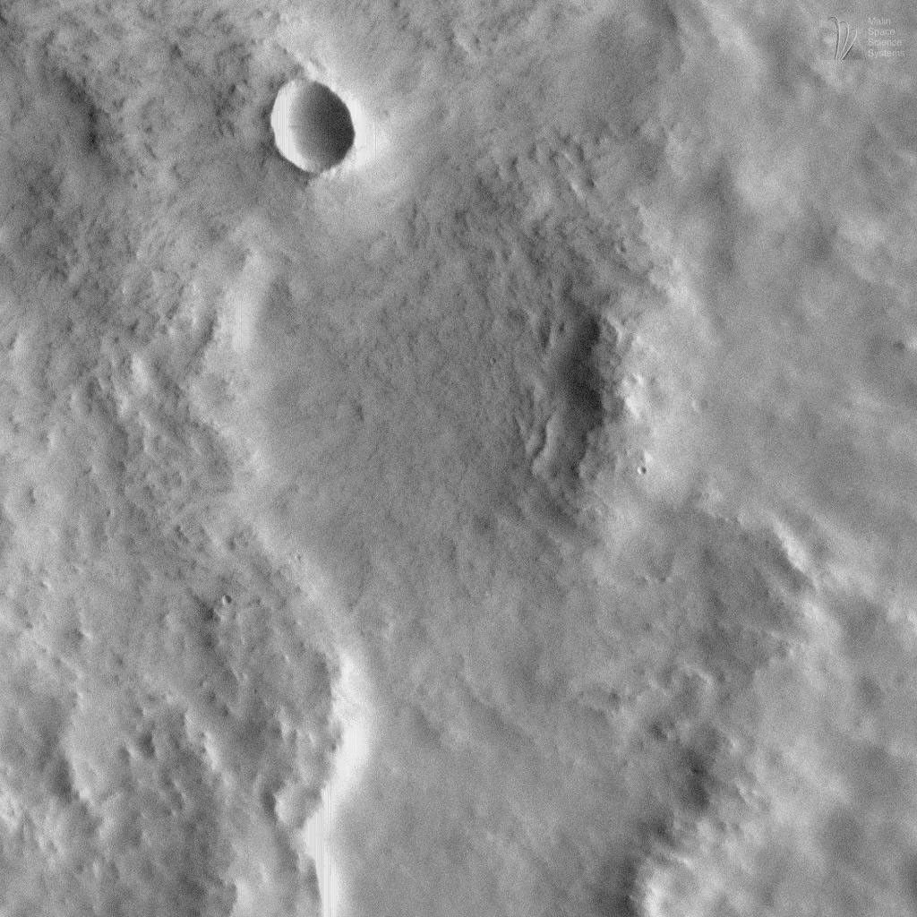 This image acquired on August 7, 1998 by NASA's Mars Global Surveyor shows ejecta from a nameless crater on the martian surface.