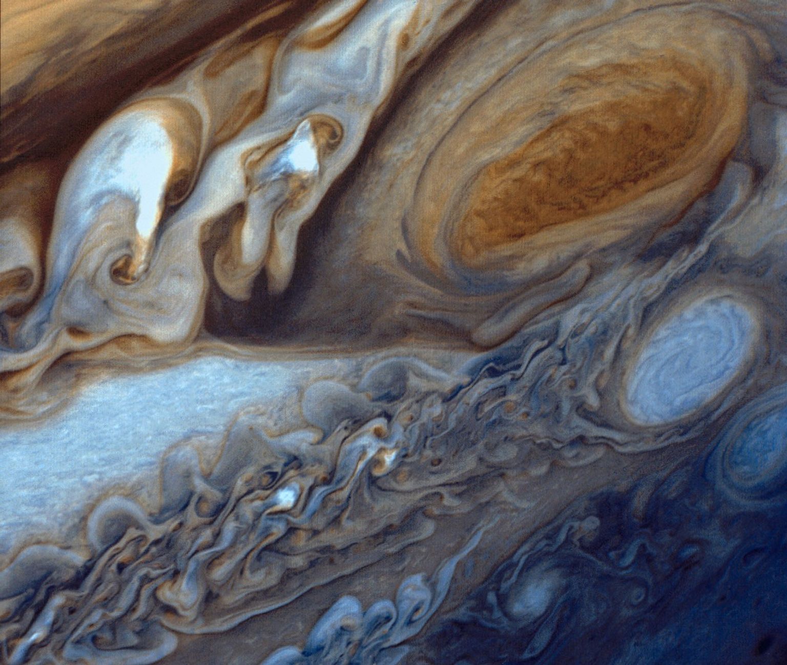 This view of Jupiter was taken by Voyager 1. This image was taken through color filters and recombined to produce the color image. This photo was assembled from three black and white negatives by the Image Processing Lab at Jet Propulsion Laboratory.