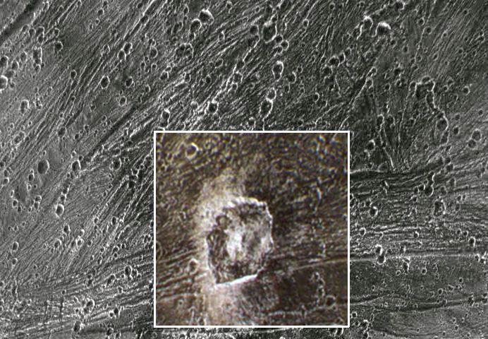 This image from NASA's Galileo spacecraft show the dark ray crater Kittu on Jupiter's moon, Ganymede. Kittu is seen in approximately true color, as imaged with the Galileo camera's violet, one micrometer, and near infrared filters.
