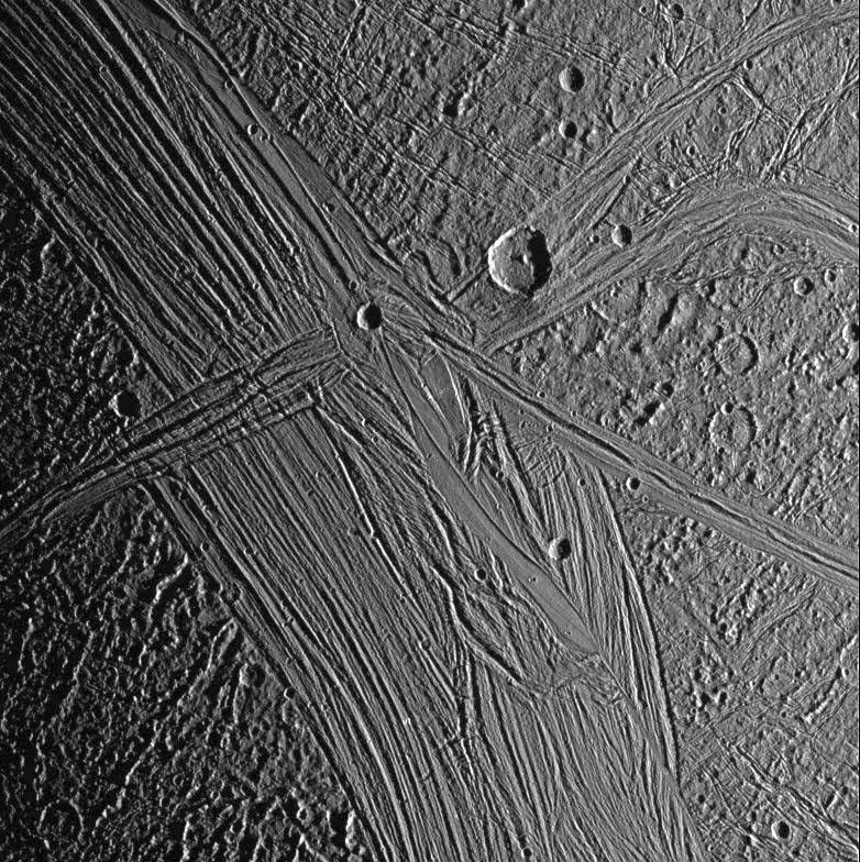 View of the Tiamat Sulcus region on Jupiter's moon, Ganymede, imaged just after local sunrise. The illumination from such a low sun angle highlights the grooved topography of Tiamat. Image from NASA's Galileo spacecraft.