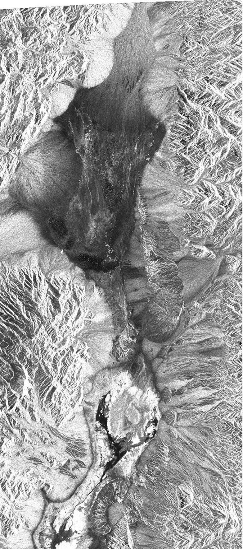 This image from NASA's Spaceborne Imaging Radar-C/X-band Synthetic Aperture Radar shows the Furnace Creek alluvial fan and Furnace Creek Ranch at the far right, and the sand dunes near Stove Pipe Wells.