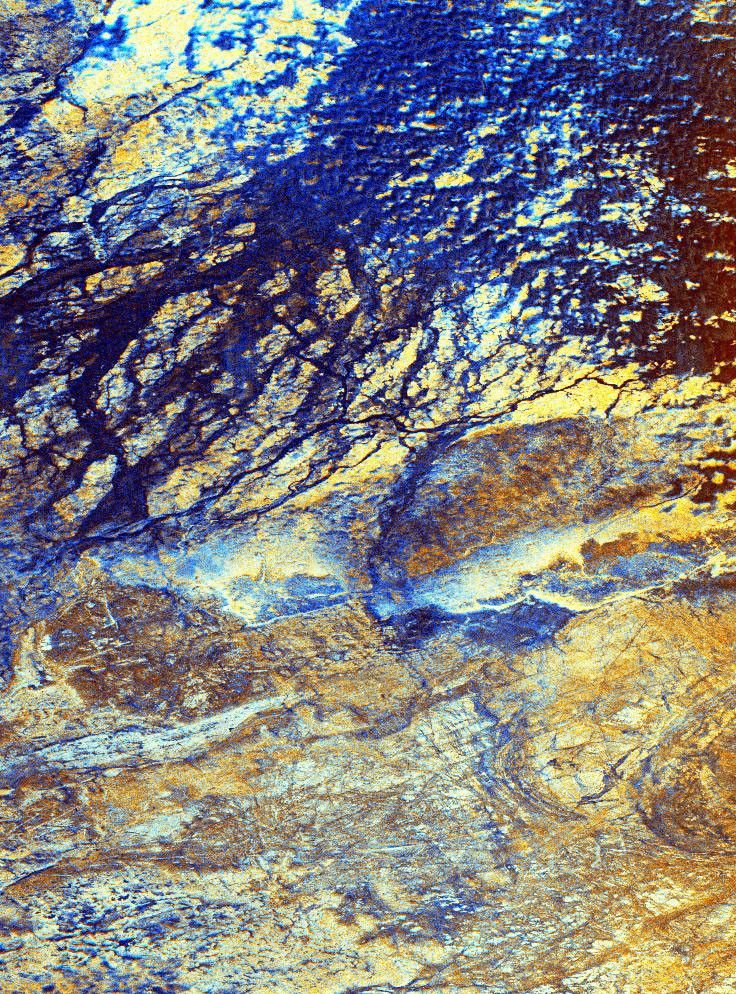 This is a false-color image from NASA's Spaceborne Imaging Radar-C/X-band Synthetic Aperture Radar of the uninhabited Safsaf Oasis in southern Egypt near the Egypt/Sudan border.