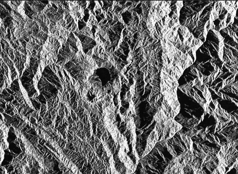 This is a radar image of a little known volcano in northern Colombia. The image was acquired on orbit 80 of space shuttle Endeavour on April 14, 1994, by NASA's Spaceborne Imaging Radar C/X-Band Synthetic Aperture Radar.
