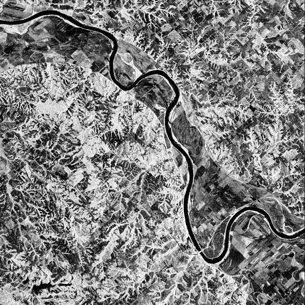 This is a false-color L-band image from NASA's Spaceborne Imaging Radar C/X-Band Synthetic Aperture Radar showing a levee near Glasgow, Missouri, centered at about 39.2 degrees north latitude and 92.8 degrees west longitude.