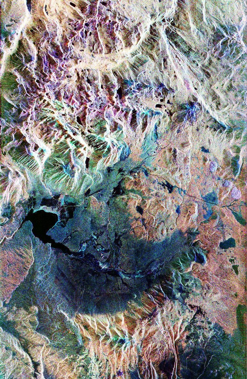This false-color composite radar image of the Mammoth Mountain area in the Sierra Nevada Mountains, California, was acquired by NASA's Spaceborne Imaging Radar-C and X-band Synthetic Aperture Radar aboard the space shuttle Endeavour.