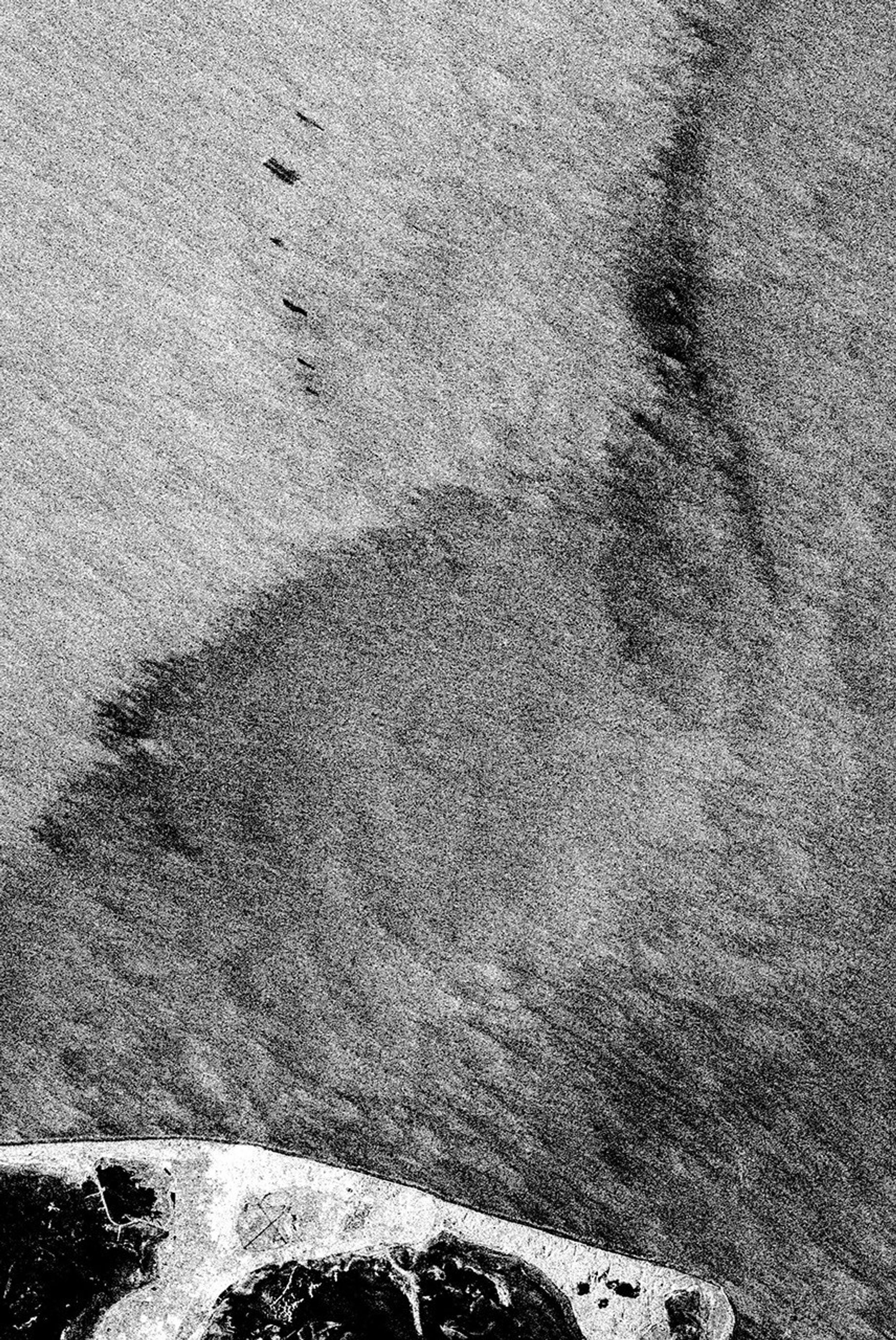 This is an X-band image from NASA's Spaceborne Imaging Radar C/X-Band Synthetic Aperture Radar of an oil slick experiment conducted in the North Sea, Germany. The image is centered at 54.58 degrees north latitude and 7.48 degrees east longitude.