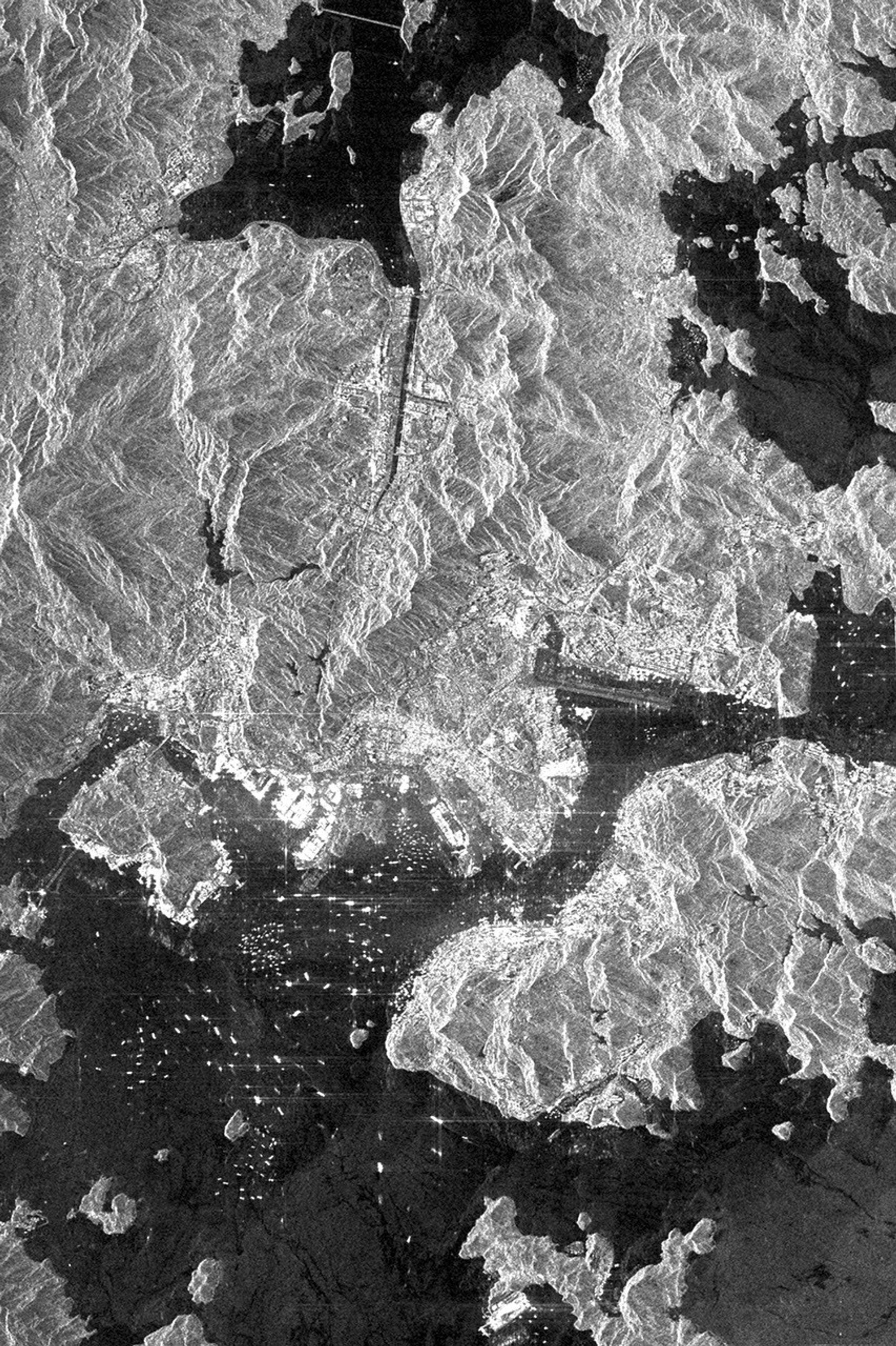 This is an X-SAR image from NASA's Spaceborne Imaging Radar C/X-Band Synthetic Aperture Radar spanning an area of the island of Hong Kong, the Kowloon Peninsula and the new territories in southern China.