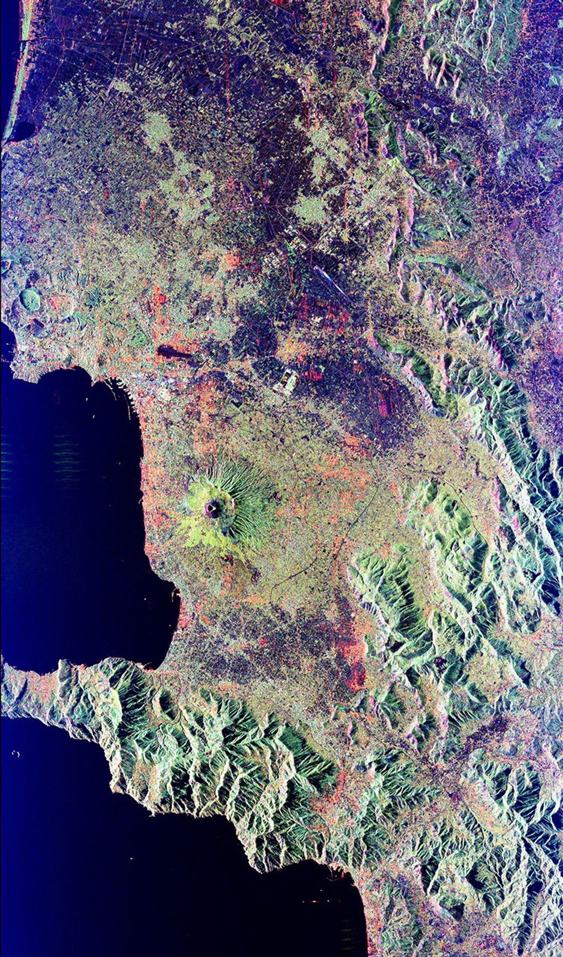Mt. Vesuvius, one of the best known volcanoes in the world primarily for the eruption that buried the Roman city of Pompeii, is shown in the center of this radar image from NASA's Spaceborne Imaging Radar-C/X-band Synthetic Aperture Radar.