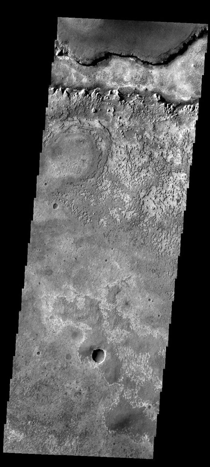 This image shows part of the Meridiani region of Mars, home of the Opportunity Rover as seen by NASA's Mars Odyssey spacecraft.