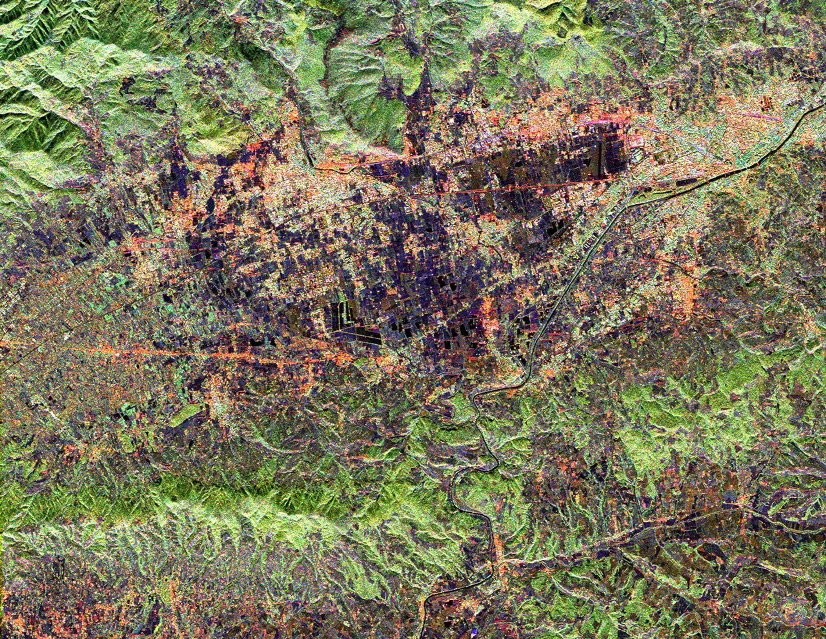 This radar image from NASA's Spaceborne Imaging Radar-C/X-band Synthetic Aperture Radar shows land use patterns in and around the city of Florence, Italy. Florence is situated on a plain in the Chianti Hill region of Central Italy.