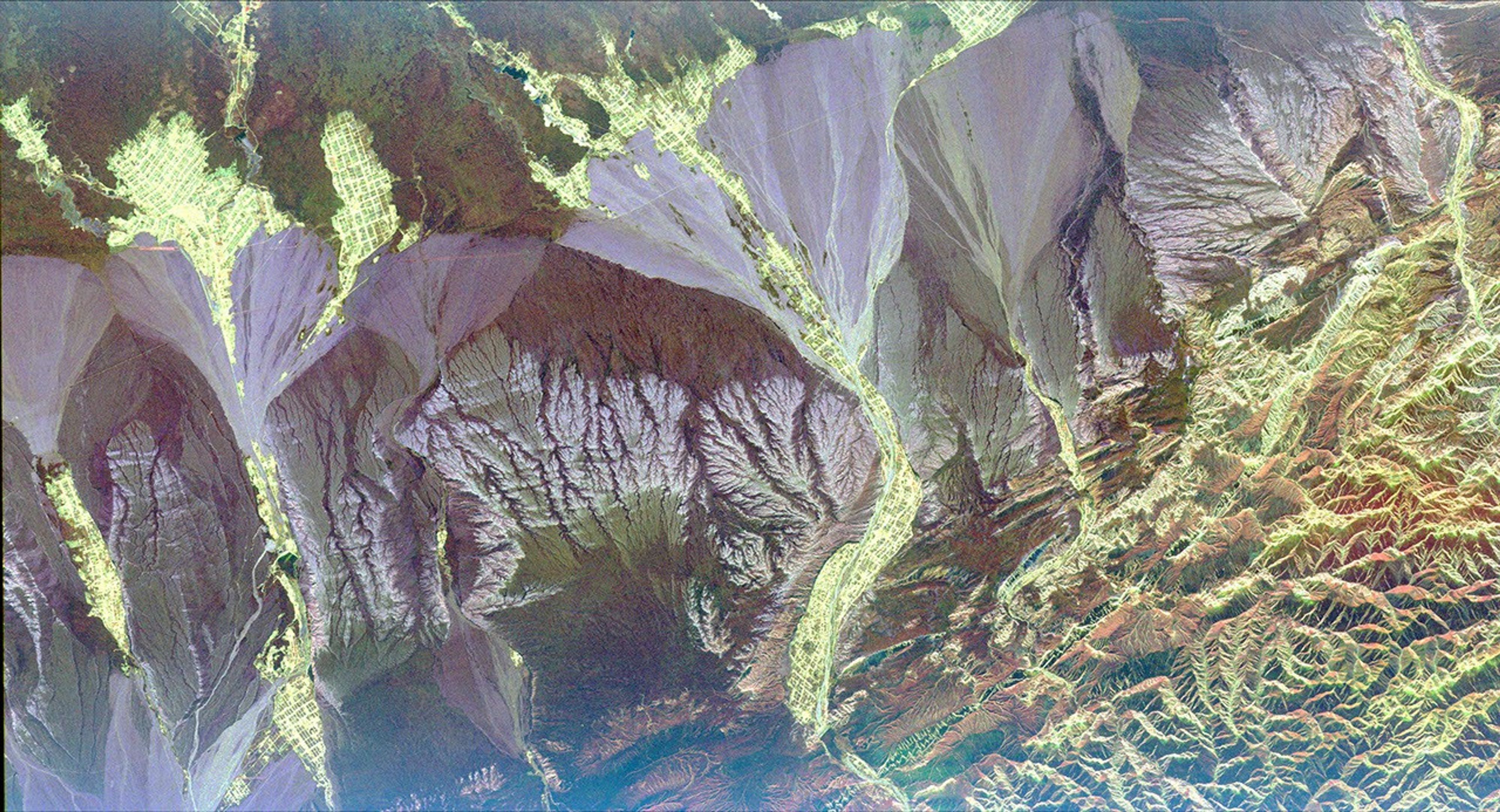 This radar image from NASA's Spaceborne Imaging Radar-C/X-band Synthetic Aperture Radar is centered near the small town of Pishan in northwest China, SE of the city of Kashgar along the ancient Silk Route in the Taklamakan desert of the Xinjiang Province.