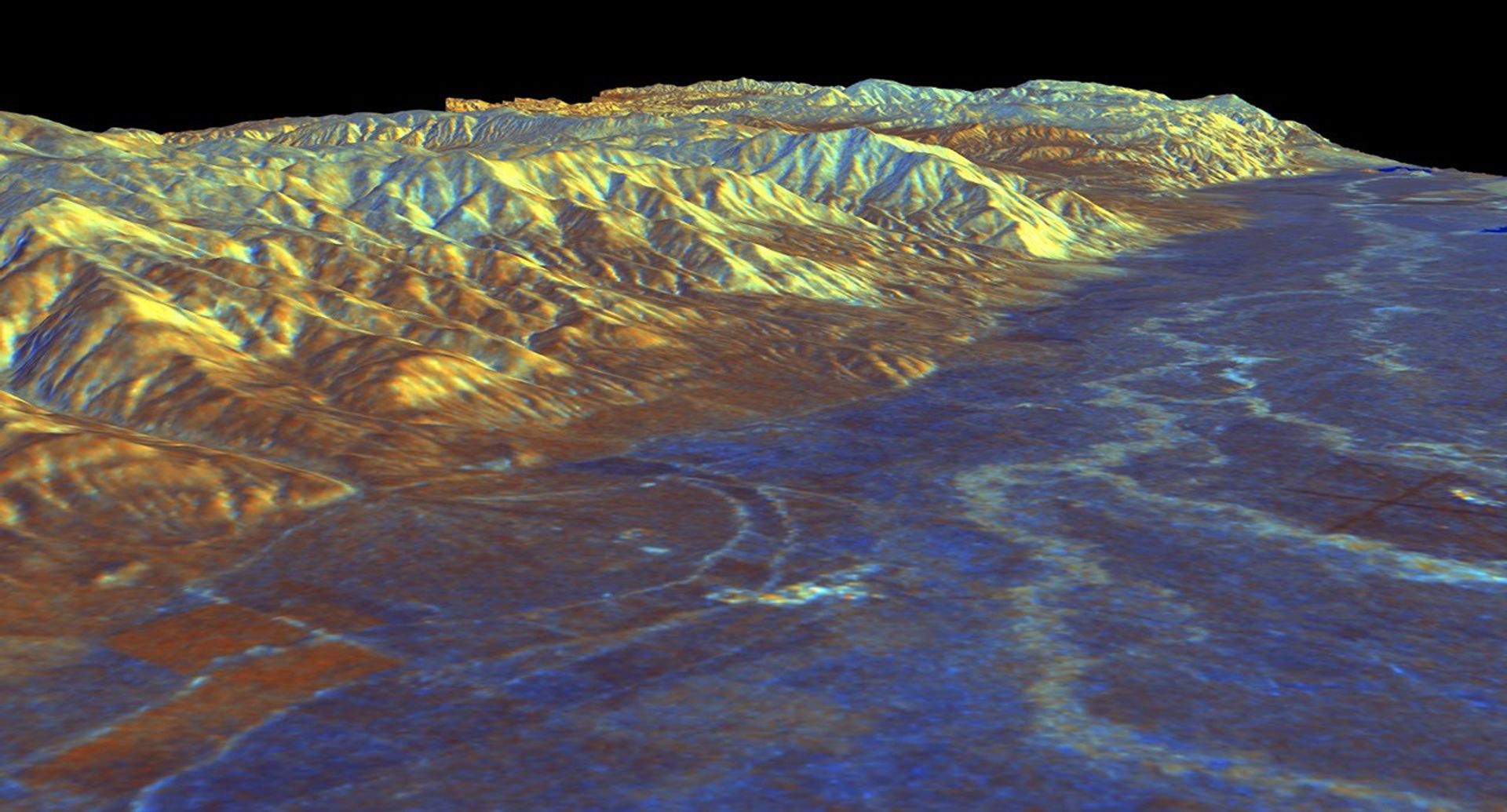 This is a three-dimensional perspective view from NASA's Spaceborne Imaging Radar C/X-Band Synthetic Aperture Radar of Owens Valley, near the town of Bishop, California.