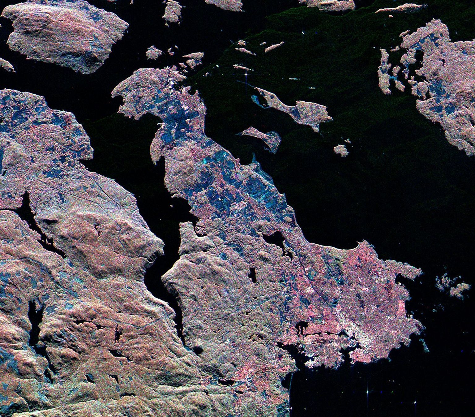 This radar image from NASA's Spaceborne Imaging Radar C/X-Band Synthetic Aperture Radar shows the southern end of Vancouver Island on the west coast of Canada. The white area is the city of Victoria, the capital of the province of British Columbia.