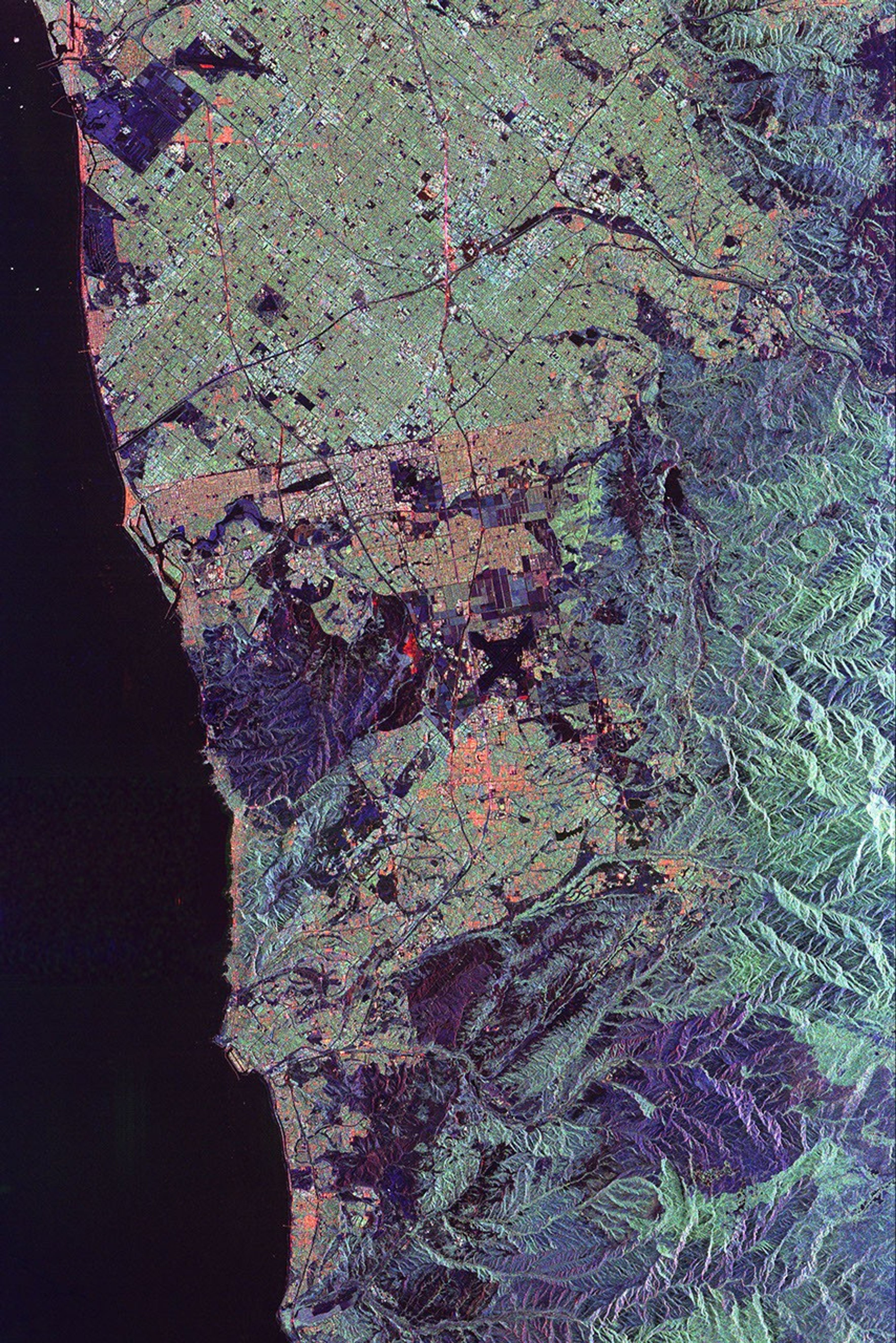 This spaceborne radar image from NASA's Spaceborne Imaging Radar C/X-Band Synthetic Aperture Radar of Orange County, Calif., shows the massive urbanization of this rapidly growing region located just south of Los Angeles.