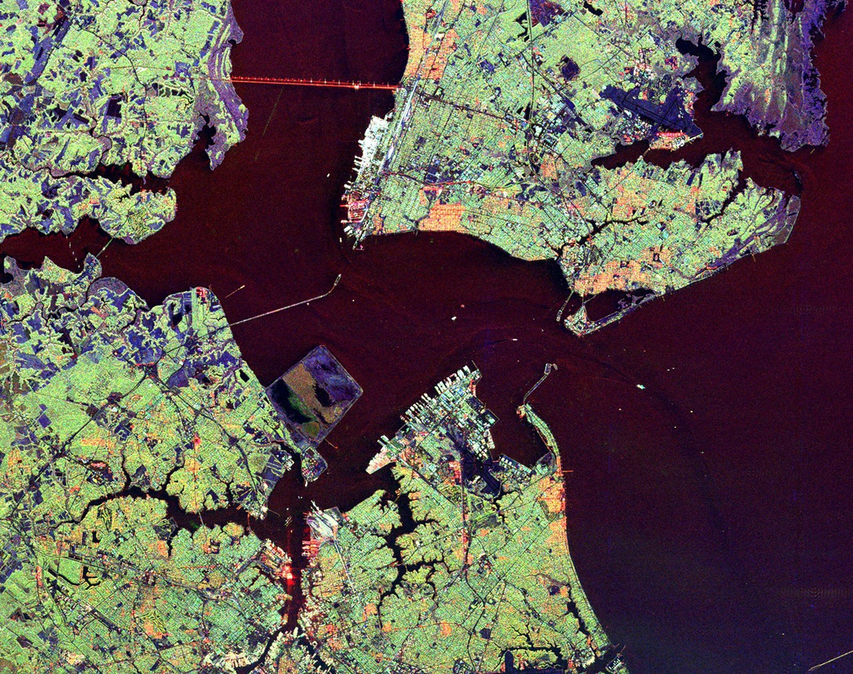 This radar image from NASA's Spaceborne Imaging Radar-C/X-band Synthetic Aperture shows the Hampton Roads, Virginia region, where the James River (upper left center) flows into the Chesapeake Bay.