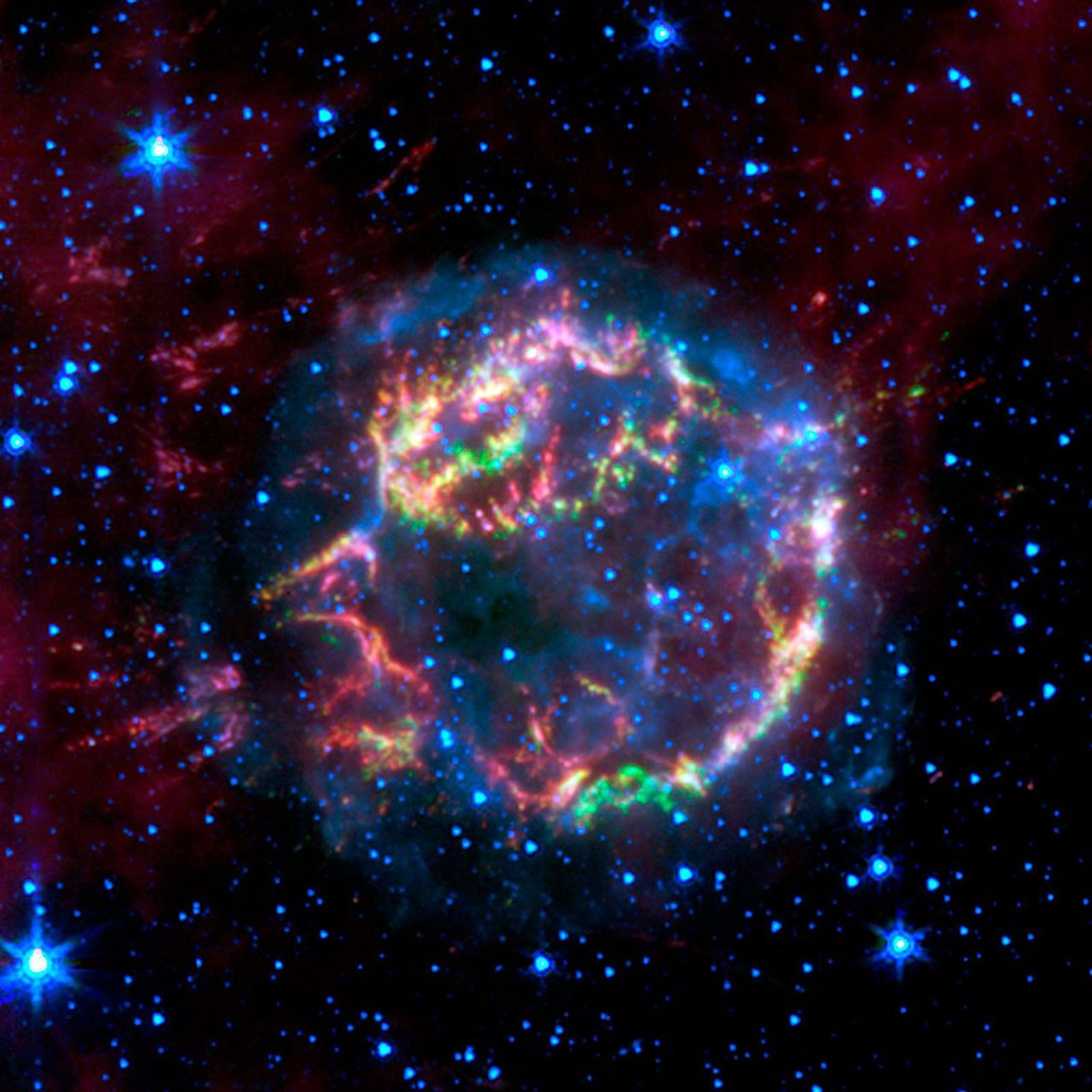 This image from NASA's Spitzer Space Telescope shows the scattered remains of an exploded star named Cassiopeia A. Spitzer's infrared detectors 'picked' through these remains and found that much of the star's original layering had been preserved.