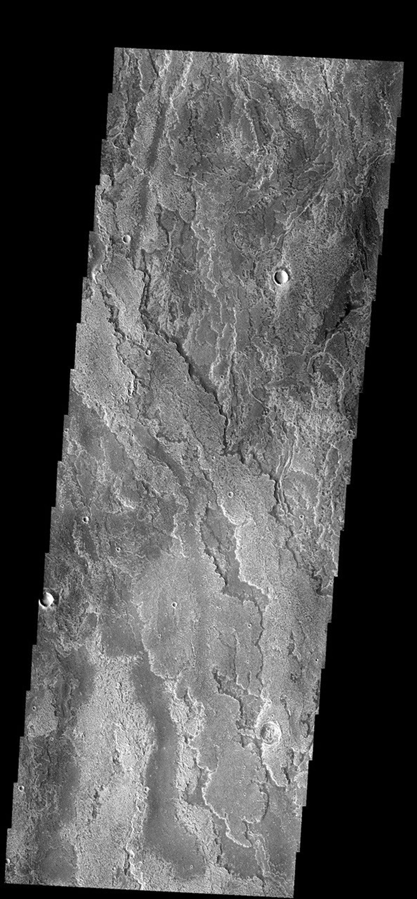 These layered volcanic flows originated from Arsia Mons on Mars as seen by NASA's 2001 Mars Odyssey spacecraft.