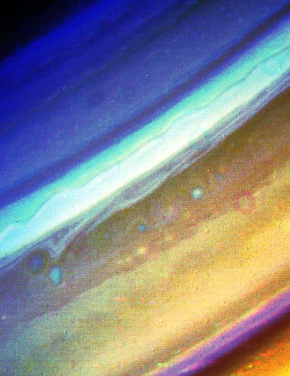 This image from NASA's Voyager 2, taken Aug. 18, 1981, from a distance of 6.8 million kilometers (4.2 million miles), shows the region extending from 20 north latitude to Saturn's polar region.
