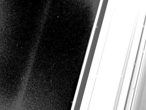 This long exposure of the ring region about 150,000 to 200,000 kilometers (90,000 to 120,000 miles) from the center of Saturn captured the very faint G-ring, seen at left. NASA's Voyager 2 took this image on Aug. 26, 1981.