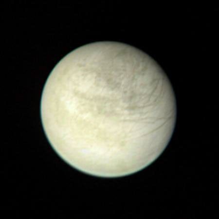 This view of Europa captured by NASA's Voyager 1 was taken from a range of 2,869,252 kilometers (1.6 million miles) on March 2 at 2:00 PM. The color composite is made from three black and white images taken through the orange, green and violet filters.