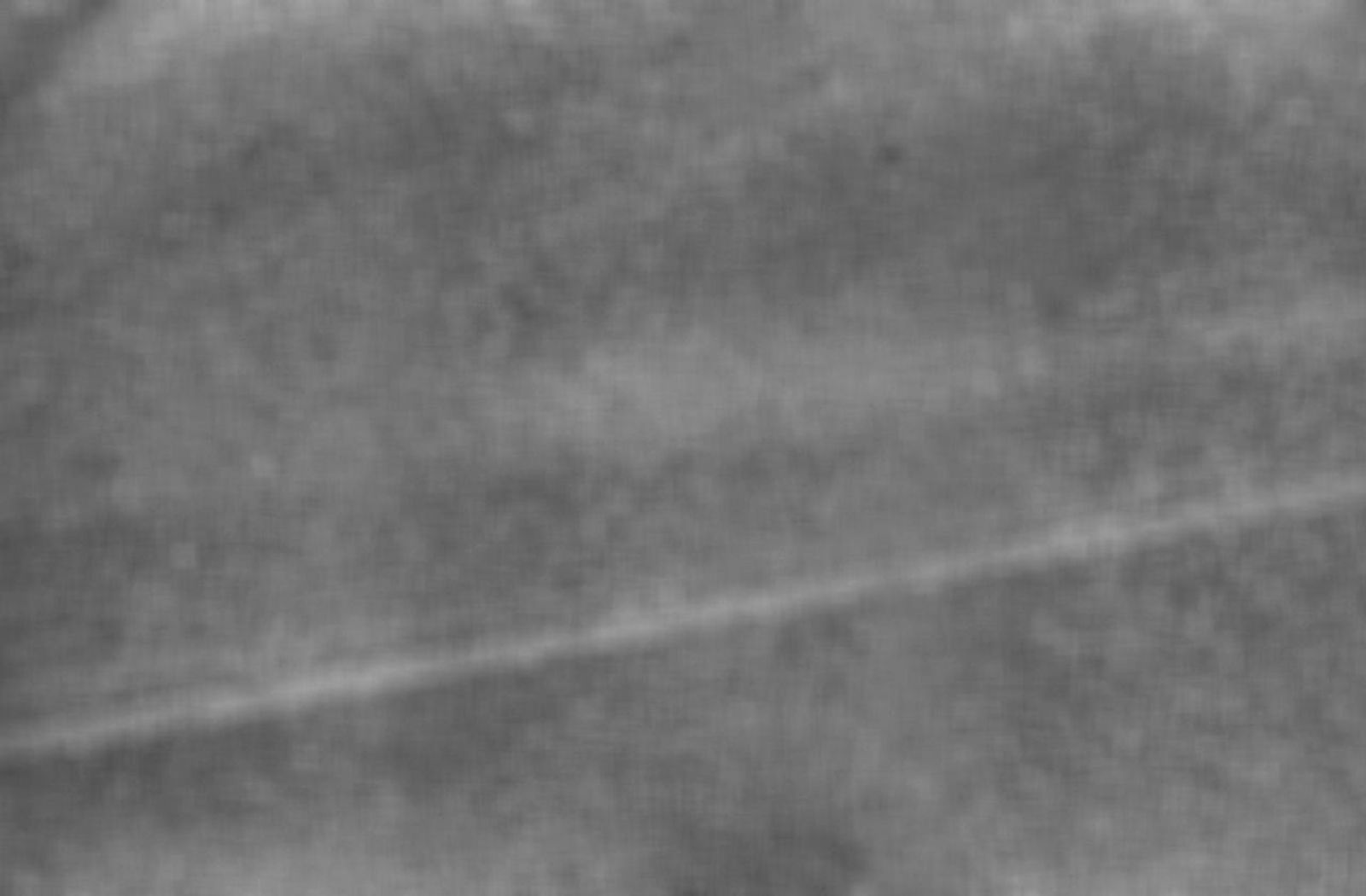 NASA's Voyager 2 took this wide-angle image of Uranus' rings as the spacecraft neared the plane of the rings less than an hour before closest approach to the planet.