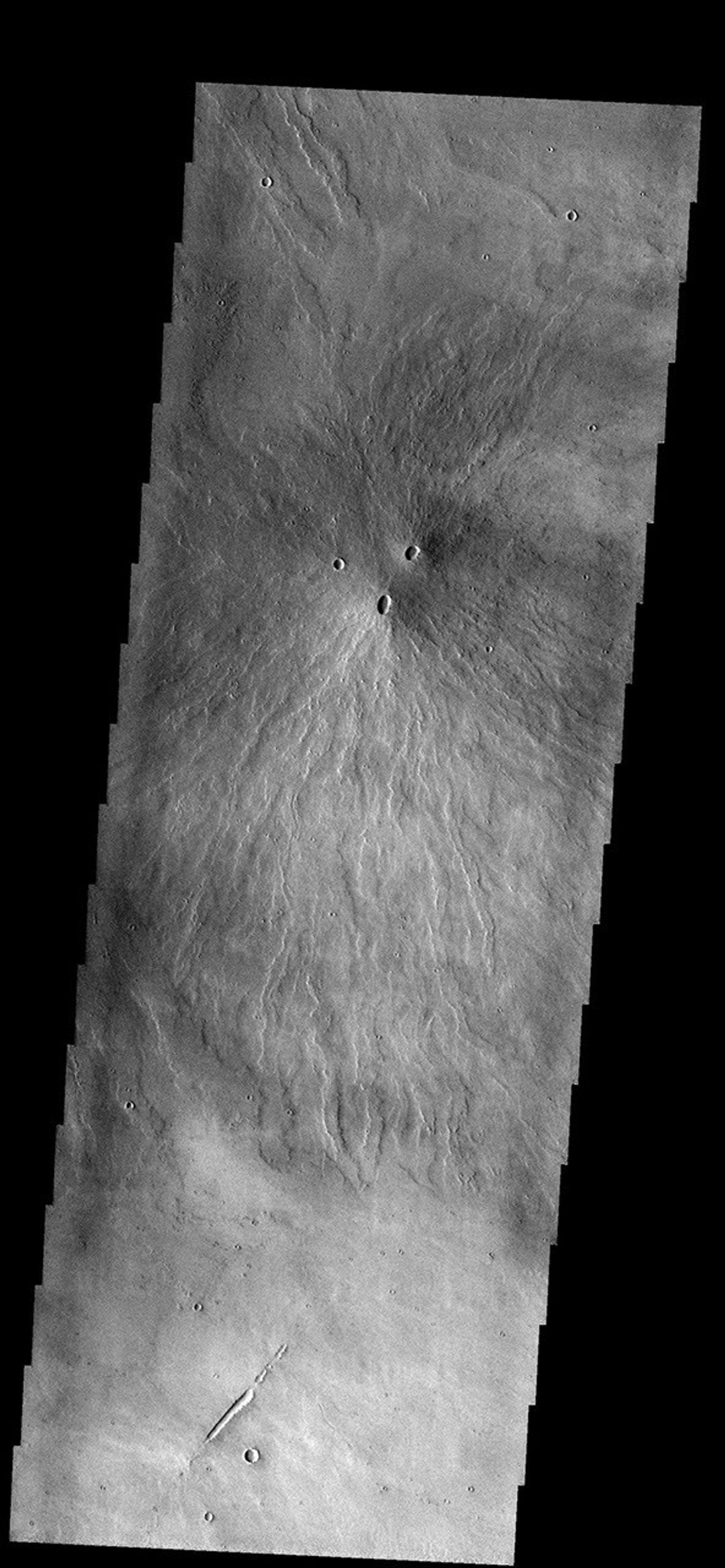Two volcanic vents have erupted material to form this small volcano just south of Pavonis Mons on Mars as seen by NASA's 2001 Mars Odyssey.