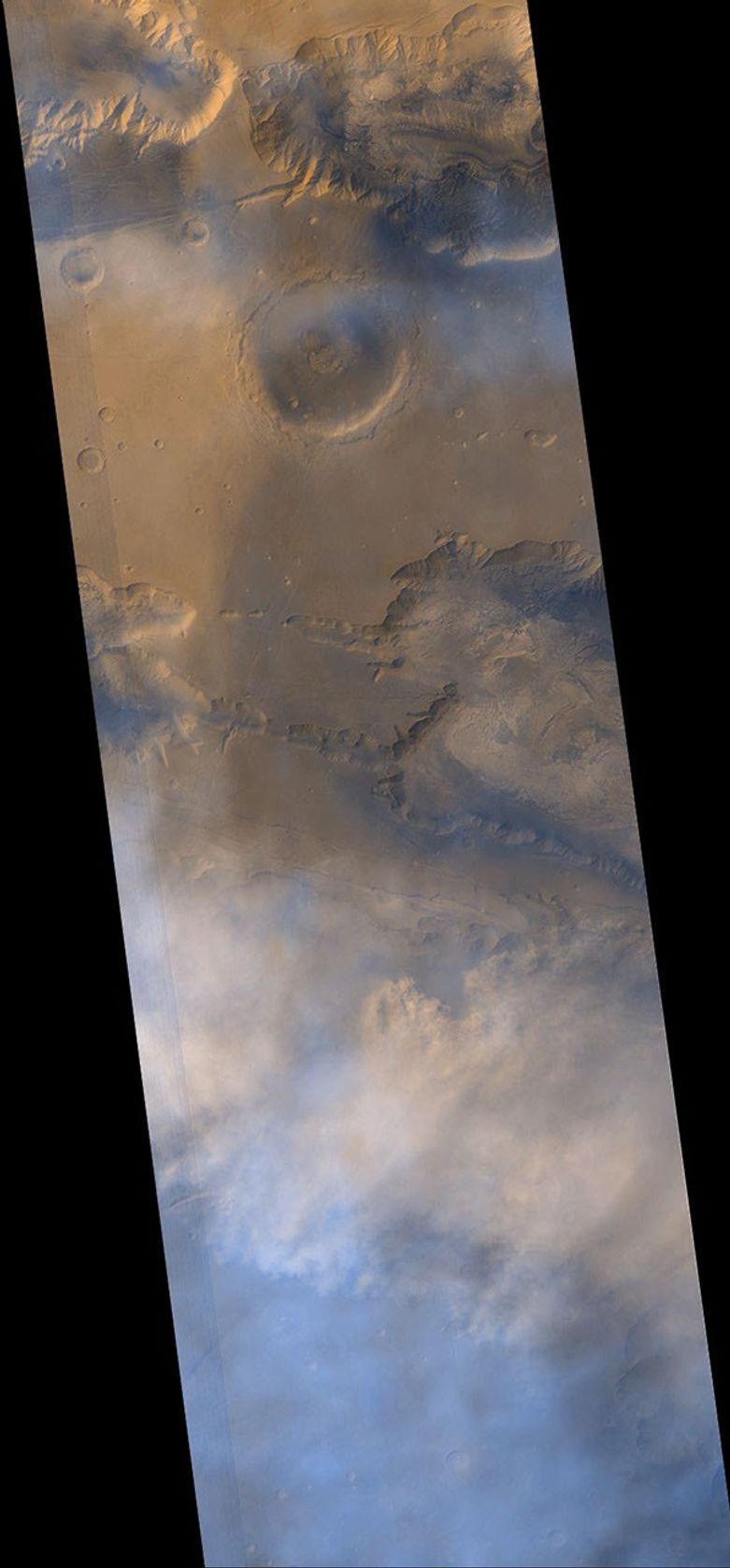 NASA's Mars Global Surveyor shows a dust storm between eastern Ius Chasma and western Melas Chasma on Mars.