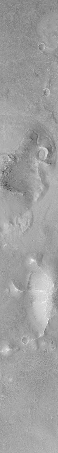 NASA's Mars Global Surveyor shows the eastern third of an impact crater located in Acidalia Planitia on Mars featuring the walls, raised rim, and ejecta material thrown out of the crater during this blast.