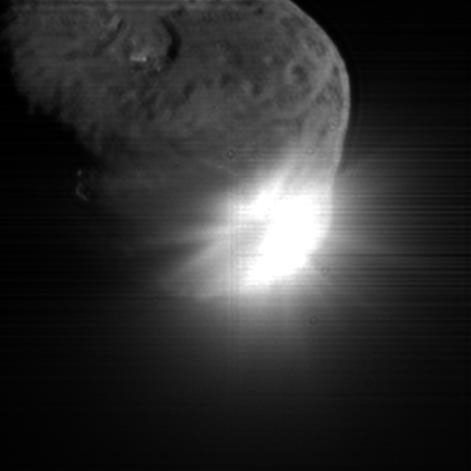 This image shows the initial ejecta that resulted when NASA's Deep Impact probe collided with comet Tempel 1 on July 3, 2005. It was taken by the spacecraft's high-resolution camera 13 seconds after impact.