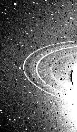 This 591-second exposure of the rings of Neptune were taken with the clear filter by NASA's Voyager 2 wide-angle camera. The two main rings are clearly visible and appear complete over the region imaged.