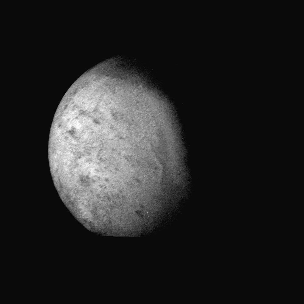 NASA's Voyager 2 was 530,000 kilometers (330,000 miles) from Neptune's largest satellite, Triton, when this photo was taken, Aug. 24, 1989. This is the first photo of Triton to reveal surface topography.