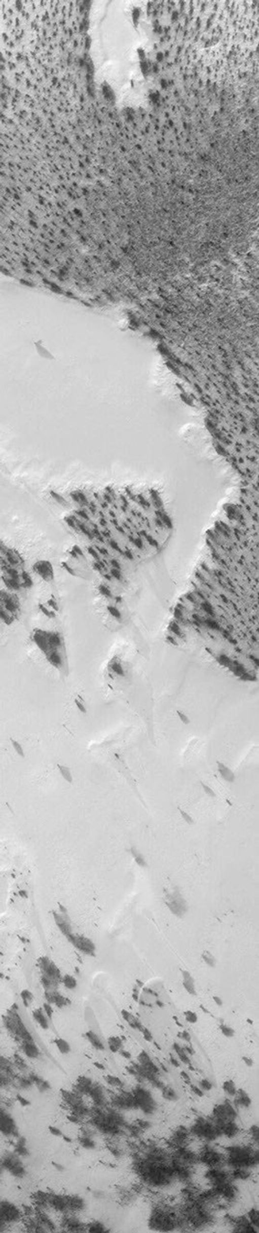 This image from NASA's Mars Global Surveyor (MGS) view (lower right, above), released on April 24, 2000, shows a 1.5 kilometer-(0.9 mile)-wide portion of the floor of Vishniac in the process of defrosting during southern spring.