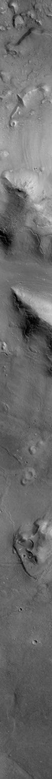 NASA's Mars Global Surveyor shows a group of four small hills surrounded by the larger mountains in the Cydonia region of Mars.