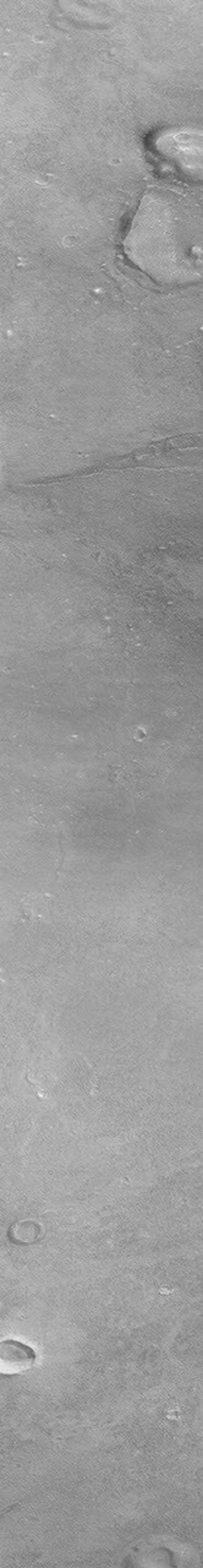 NASA's Mars Global Surveyor shows a group of four small hills surrounded by the larger mountains in the Cydonia region of Mars.