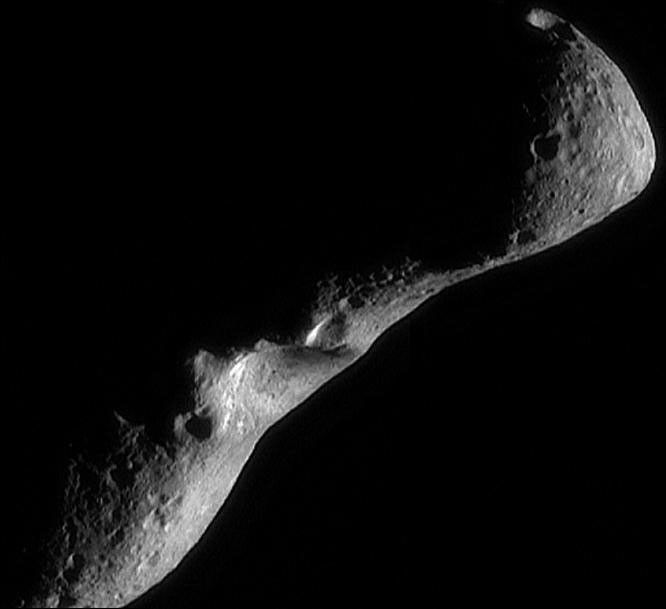 This image was taken by NASA's NEAR Shoemaker spacecraft on Feb 18, 2000 as it flew over the shadowed southern hemisphere, looking north at a crescent asteroid Eros.