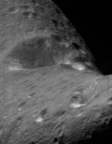 This image taken by NASA's NEAR Shoemaker on April 1, 2000, shows the floor of an impact crater that dominates one face of asteroid Eros.