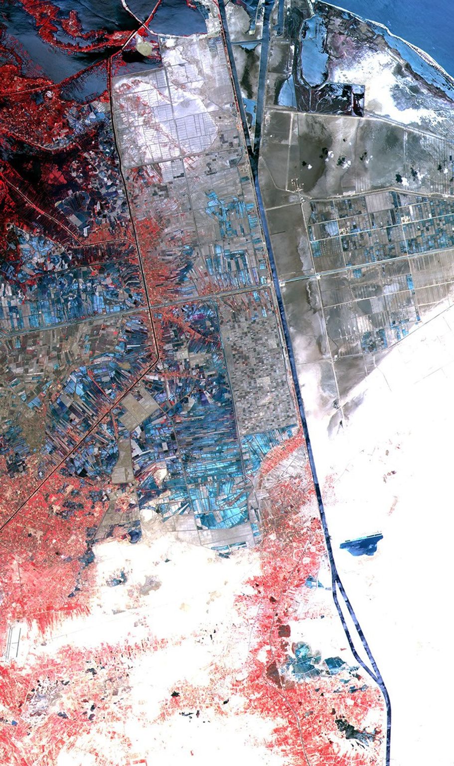 One of the most important waterways in the world, the Suez Canal runs north to south across the Isthmus of Suez in northeastern Egypt. NASA's Terra satellite acquired the scene on May 19, 2000.