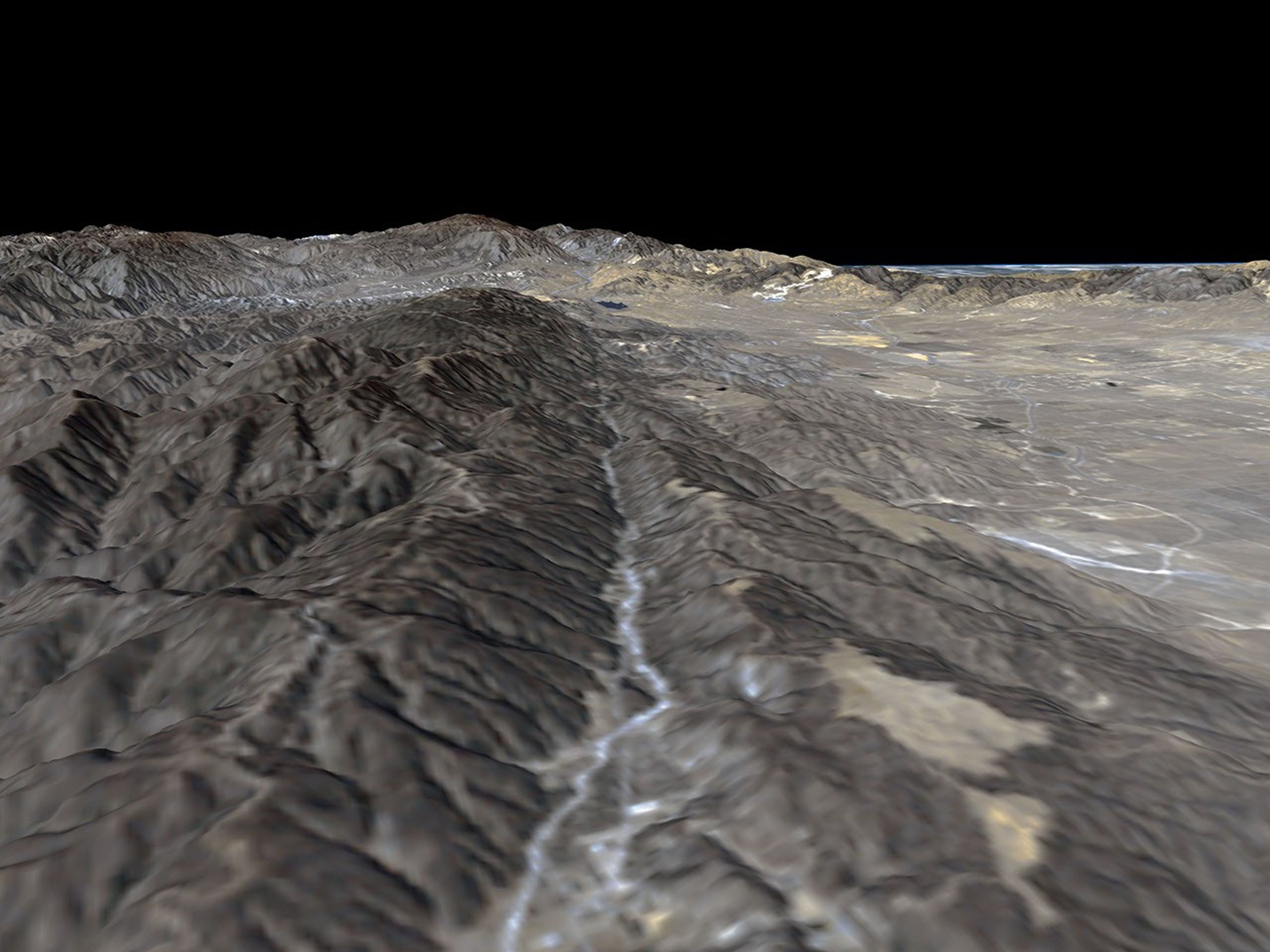 The prominent linear feature straight down the center of this perspective view is California's famous San Andreas Fault. The image was created with data from NASA's Shuttle Radar Topography Mission.