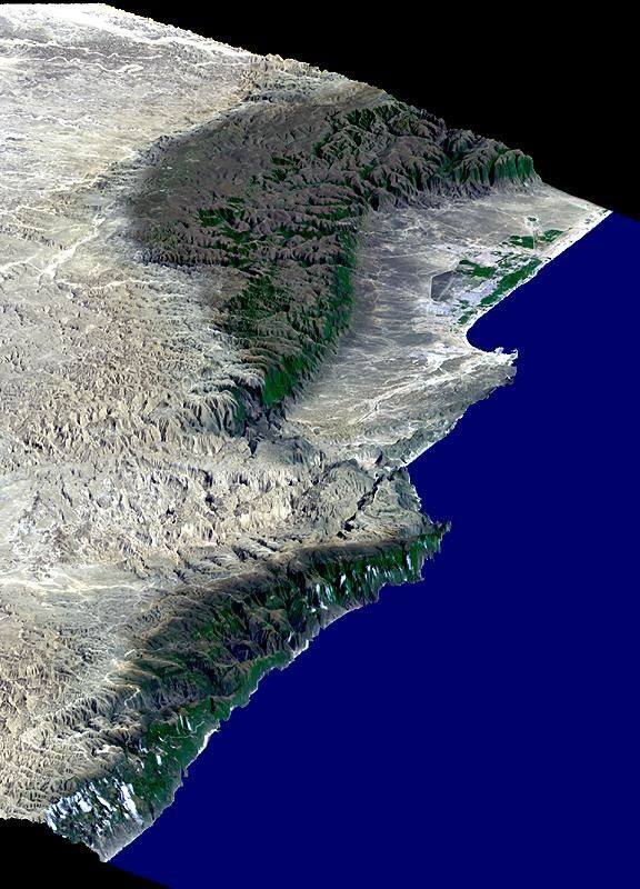 This perspective view from NASA's Shuttle Radar Topography Mission includes the city of Salalah, the second largest city in Oman. The city is located on the broad, generally bright coastal plain and includes areas of green irrigated crops.