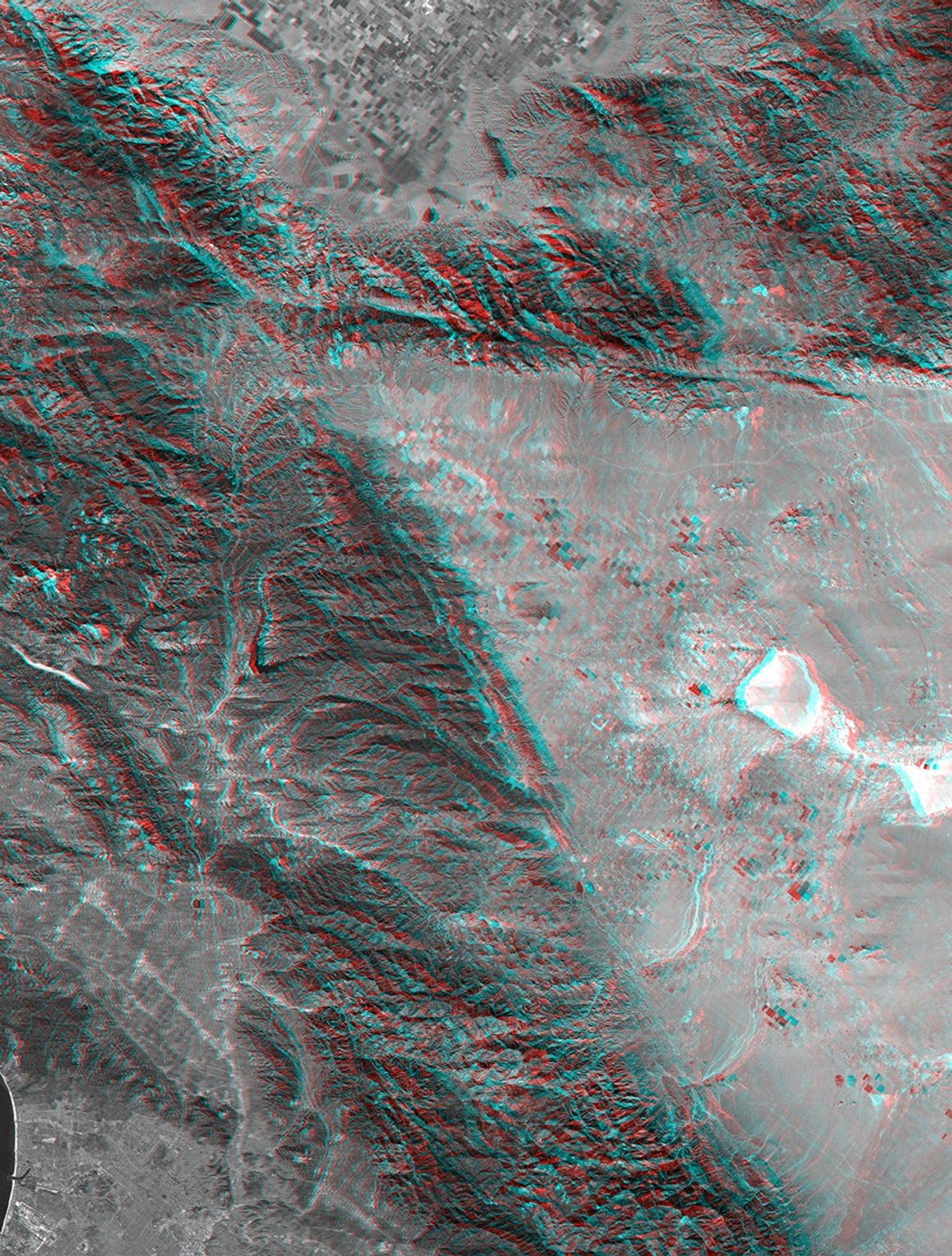 This anaglyph, from NASA's Shuttle Radar Topography Mission, shows rugged terrain between Los Angeles and California's central valley. 3D glasses are necessary to view this image.