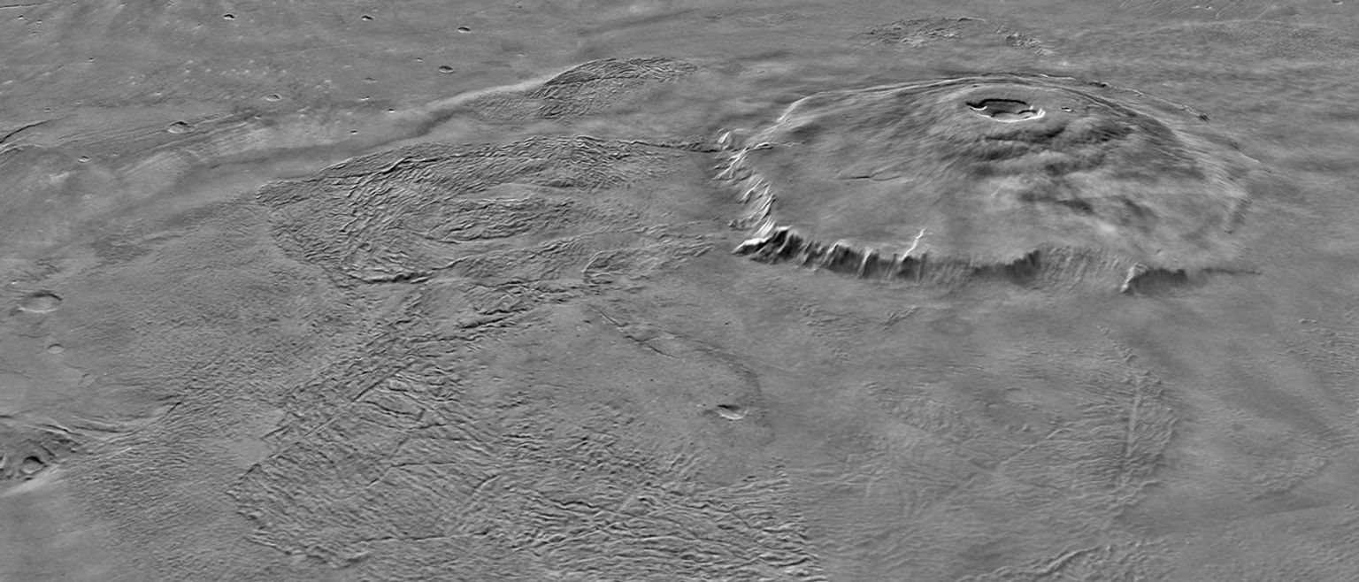 NASA's Mars Global Surveyor shows two views of Olympus Mons on Mars featuring the volcano's scarp and massive aureole deposit that was produced by flank collapse.