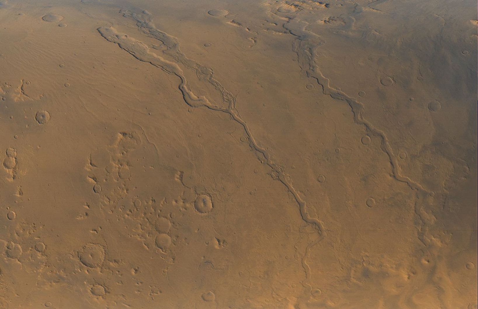 NASA's Mars Global Surveyor shows the Dao, Niger, and Harmakhis Valles on Mars.