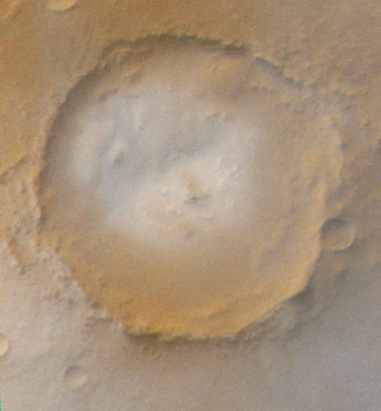 NASA's Mars Global Surveyor shows frosted craters of northern spring and southern autumn in an unnamed crater on Mars.